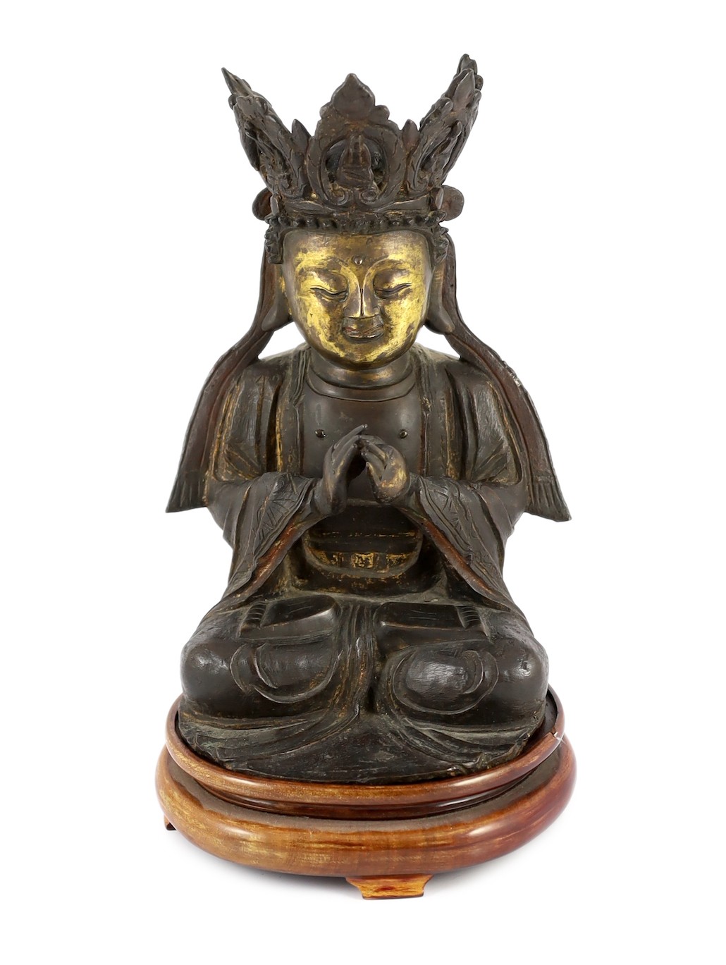 A Chinese late Ming bronze seated figure of Guanyin, 29.5cm high